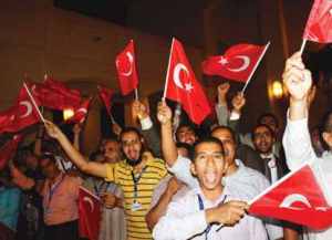 Thousands of Egyptians rushed to greet the Turkish Prime Minister, chanting “Egypt, Turkey - one fist”.